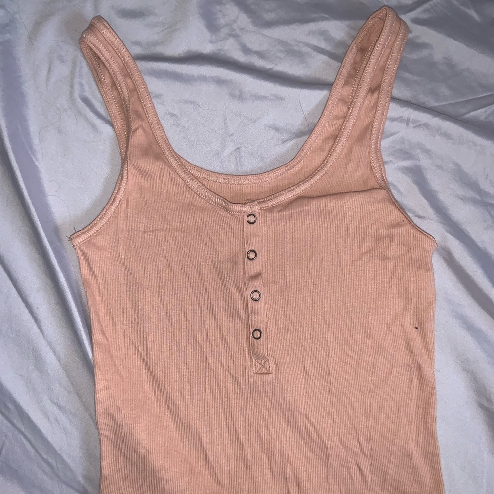Peach/beige colored crop top